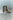 Women's brown snake print leather ankle boot with stiletto heel, pointed toe and gold buckle detailing