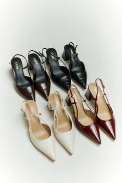 Women's chocolate brown patent leather slingback block heel with buckle fastening and pointed toe
