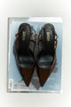 Women's chocolate brown patent leather slingback block heel with buckle fastening and pointed toe