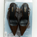 Women's chocolate brown patent leather slingback block heel with buckle fastening and pointed toe
