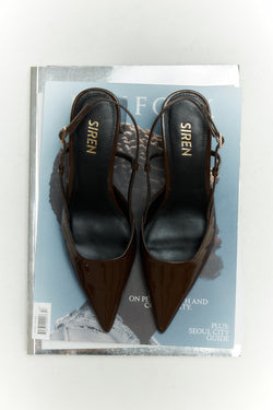 Women's chocolate brown patent leather slingback block heel with buckle fastening and pointed toe