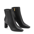 Women's black leather heeled ankle boot with pointed toe and thin block heel