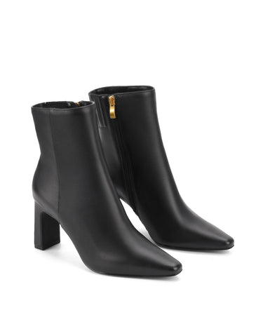 Women's black leather heeled ankle boot with pointed toe and thin block heel