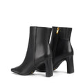 Women's black leather heeled ankle boot with pointed toe and thin block heel