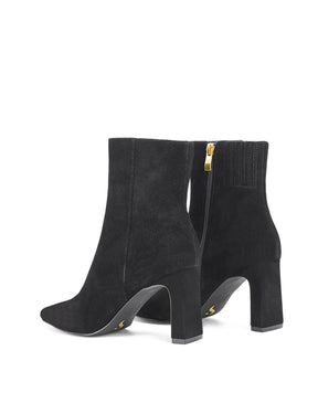Women's black suede heeled ankle boot with pointed toe and thin block heel