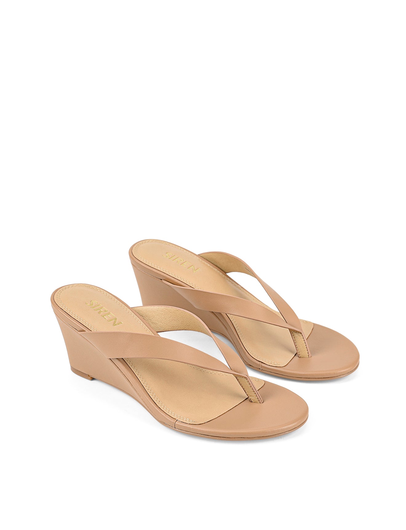 Women's wedge heeled thong in almond tan leather