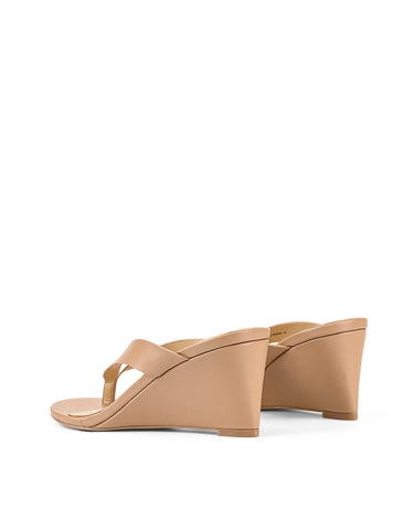 Women's wedge heeled thong in almond tan leather