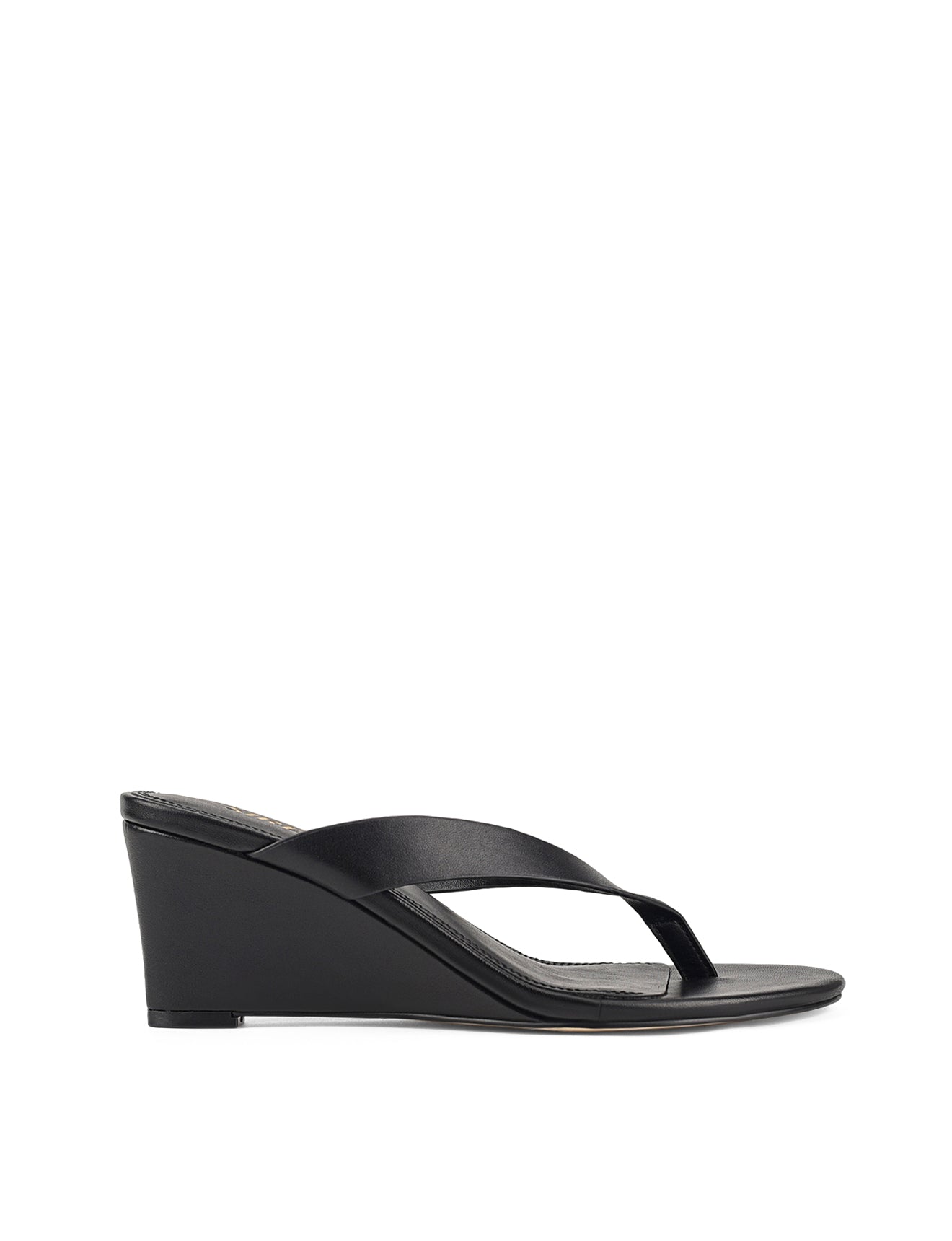 Women's wedge heeled thong in smooth black leather