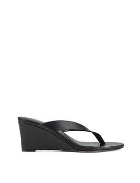 Women's wedge heeled thong in smooth black leather