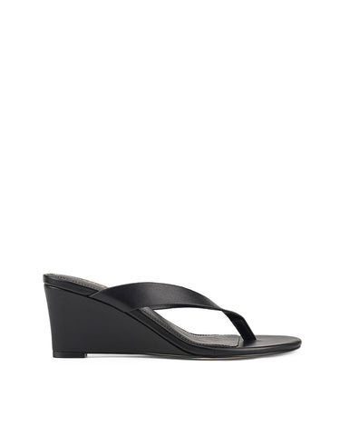 Women's wedge heeled thong in smooth black leather