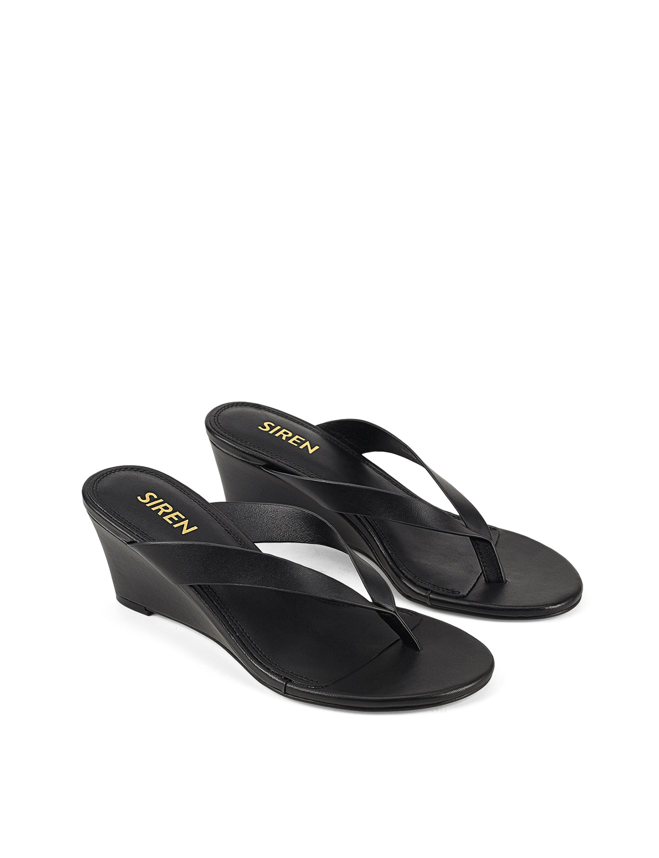 Women's wedge heeled thong in smooth black leather