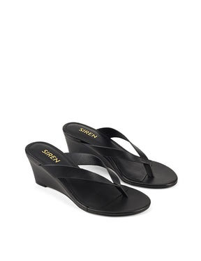 Women's wedge heeled thong in smooth black leather