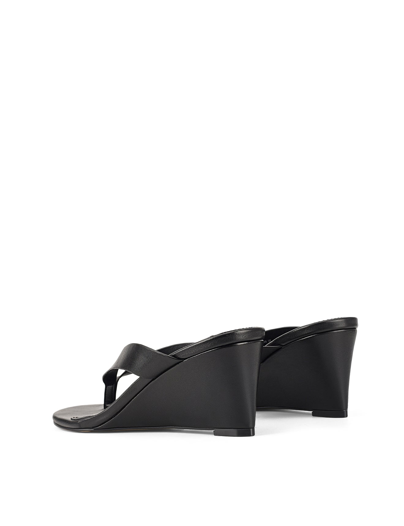 Women's wedge heeled thong in smooth black leather