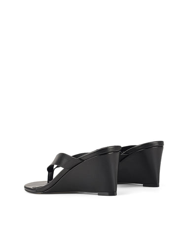 Women's wedge heeled thong in smooth black leather