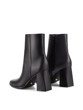 Womens Black leather ankle boot with inner zipper closure and subtle square toe shape