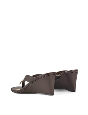 Women's chocolate brown leather wedge thong sandal with gold accent