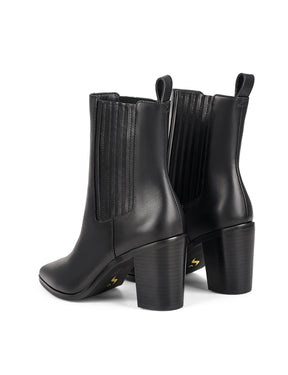 Women's black leather ankle boot with stacked leather heel, pointed toe and elastic gusset