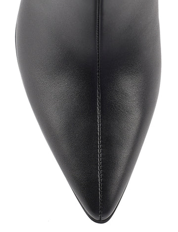 Women's high heel knee high boot with pointed toe and curved upper