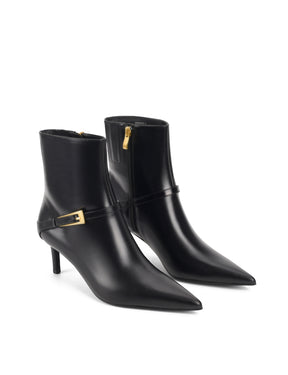 Women's black leather ankle boot with stiletto heel, pointed toe and gold buckle detailing