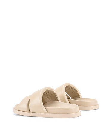 Women's beige leather footbed slide with puffy vamp upper