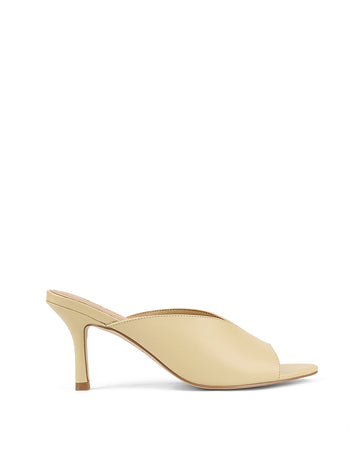 Women's heeled mule with v cut upper and pointed toe in custard yellow leather