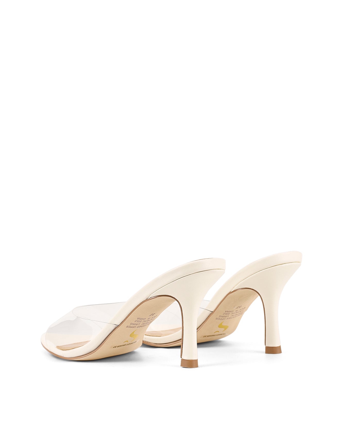 Women's low mid heel mules in chalk white leather with pointed toe and clear vinylite upper