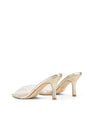 Women's low mid heel mules in gold metallic leather with pointed toe and clear vinylite upper