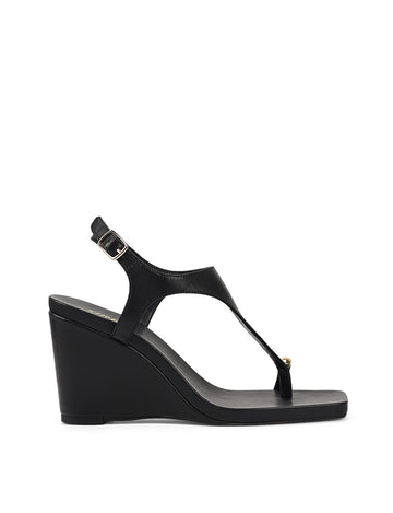 Women's black leather heeled wedge with gold metal toe ring details