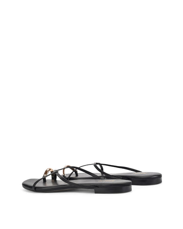 Women's black leather strappy flats with gold toe ring