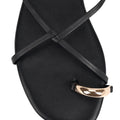 Women's black leather strappy flats with gold toe ring