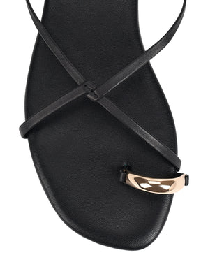 Women's black leather strappy flats with gold toe ring