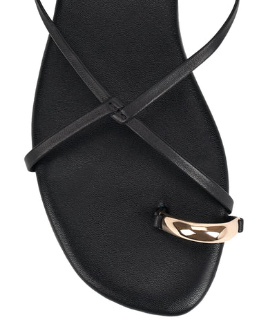 Women's black leather strappy flats with gold toe ring