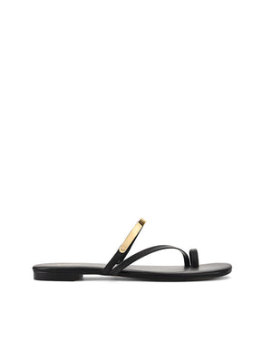 Women's black leather flat slide with gold metallic embellishment, dainty straps and toe ring