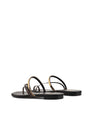 Women's black leather and brown snake flat slide with gold metallic embellishment, dainty straps and toe ring