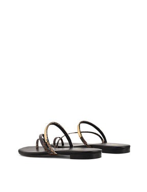 Women's black leather and brown snake flat slide with gold metallic embellishment, dainty straps and toe ring
