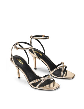 Women's gold mirror metallic strappy stiletto heels with buckle embellishment