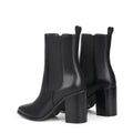 Women's black leather chelsea booth with stacked block heel, pointed toe and elastic gusset
