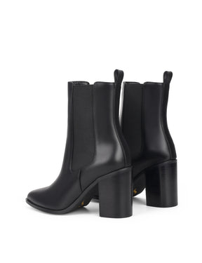 Women's black leather chelsea booth with stacked block heel, pointed toe and elastic gusset