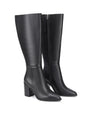 Women's black leather knee high boot with stacked leather block high heel and pointed toe. 