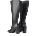 Women's black leather knee high boot with stacked leather block high heel and pointed toe. 