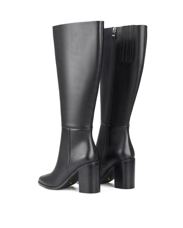 Women's black leather knee high boot with stacked leather block high heel and pointed toe. 