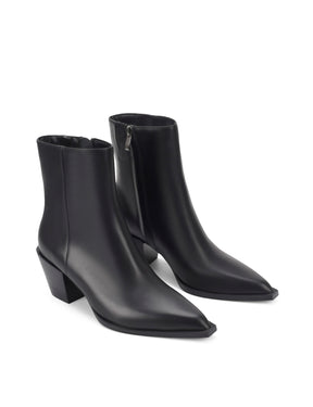 Women's premium leather ankle boot in black, inspired by cowboy western boots, with structural block heel and pointed toe