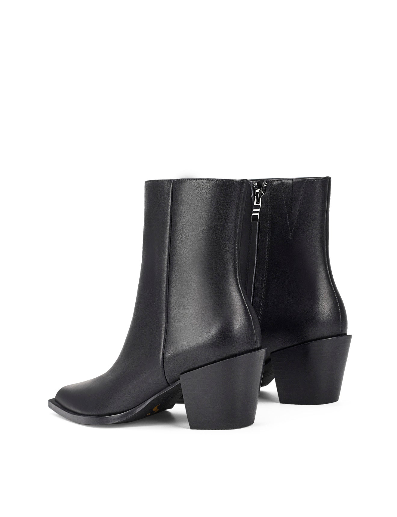 Women's premium leather ankle boot in black, inspired by cowboy western boots, with structural block heel and pointed toe