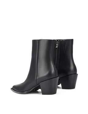 Women's premium leather ankle boot in black, inspired by cowboy western boots, with structural block heel and pointed toe