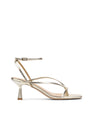 Gold high-heeled sandal on a white background