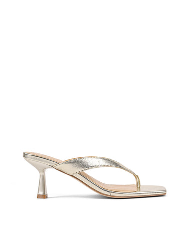 Women's thong heeled sandal mule with square toe in metallic gold leather