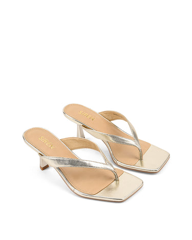 Women's thong heeled sandal mule with square toe in metallic gold leather