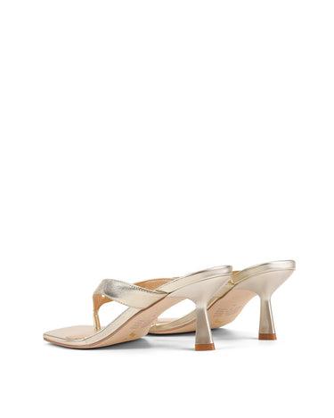Women's thong heeled sandal mule with square toe in metallic gold leather