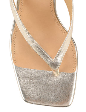 Women's thong heeled sandal mule with square toe in metallic gold leather