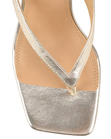 Women's thong heeled sandal mule with square toe in metallic gold leather